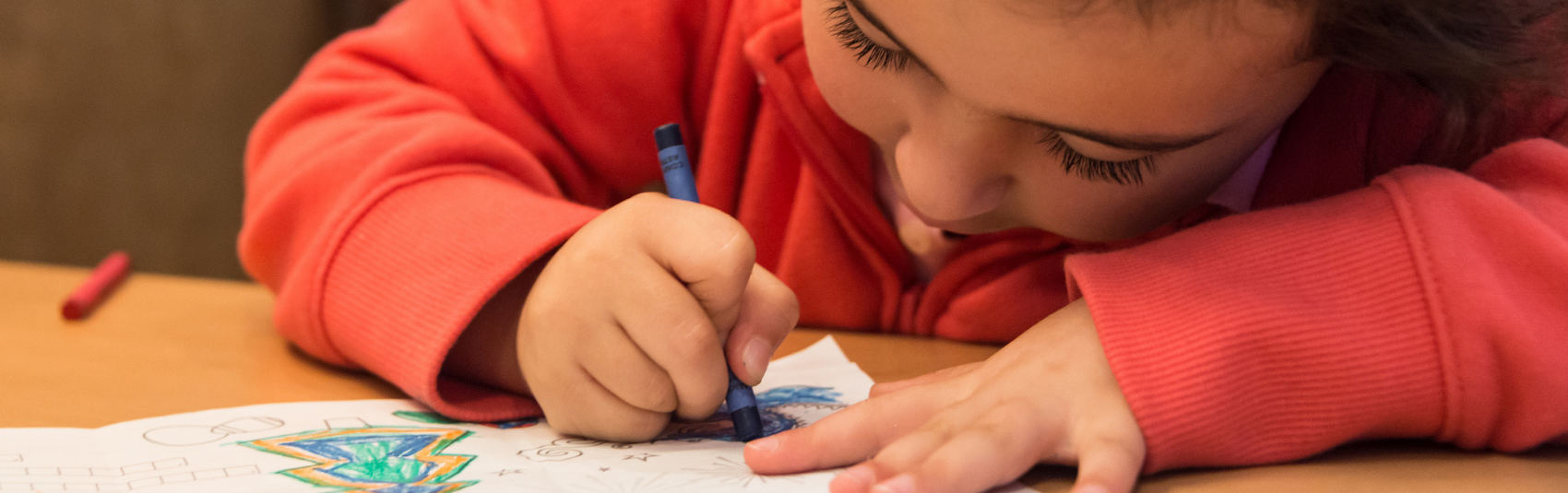 Child Drawing with Crayons