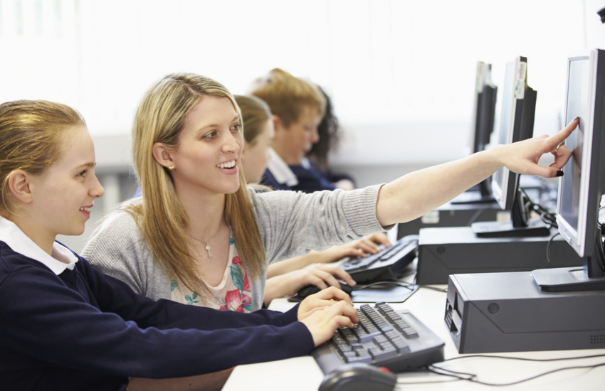 Student and Teacher with Computer