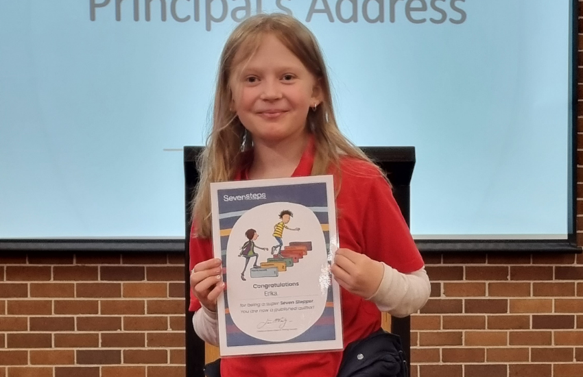 Year 3 student with her informative writing certificate