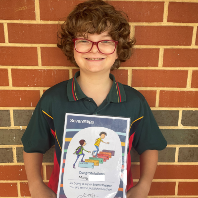 Year 5 student with his Seven Steps certificate