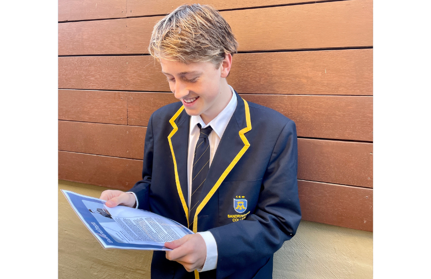 Year 6 student looking down at his printed writing sample