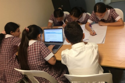Students focused on writing activities