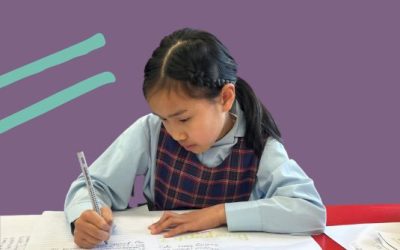 Student writing in class